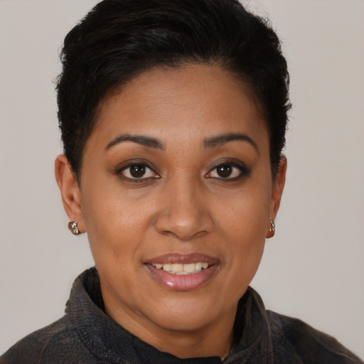 Joyful latino young-adult female with short  brown hair and brown eyes