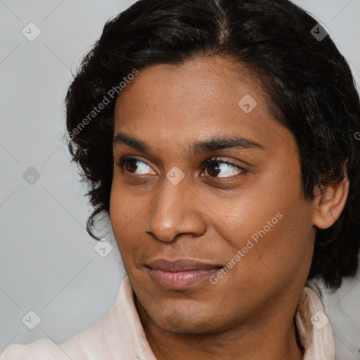 Joyful black young-adult female with medium  brown hair and brown eyes