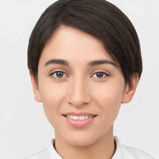 Joyful white young-adult female with short  brown hair and brown eyes