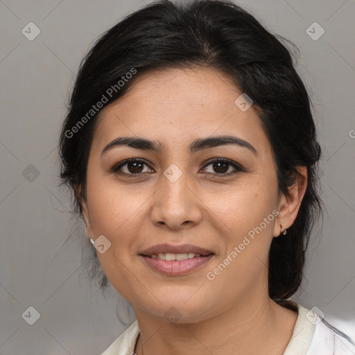 Joyful latino young-adult female with medium  brown hair and brown eyes