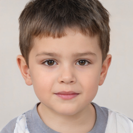 Joyful white child male with short  brown hair and brown eyes