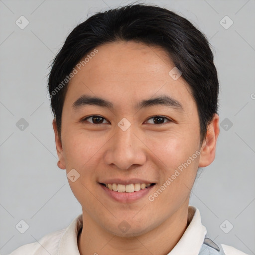 Joyful asian young-adult male with short  brown hair and brown eyes