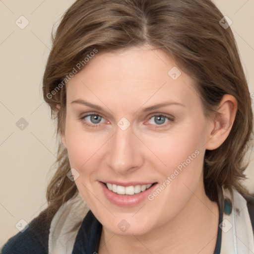 Joyful white young-adult female with medium  brown hair and blue eyes