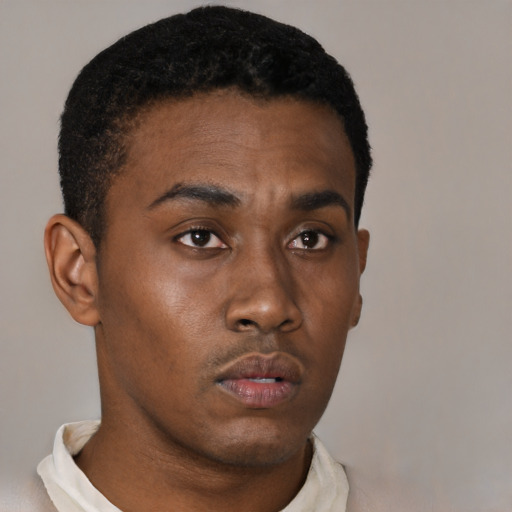 Neutral black young-adult male with short  brown hair and brown eyes