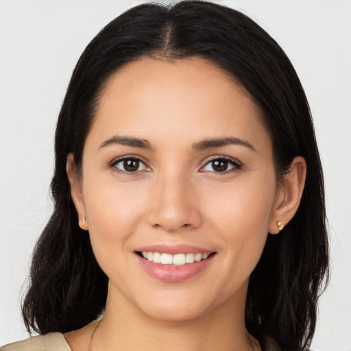 Joyful white young-adult female with long  brown hair and brown eyes