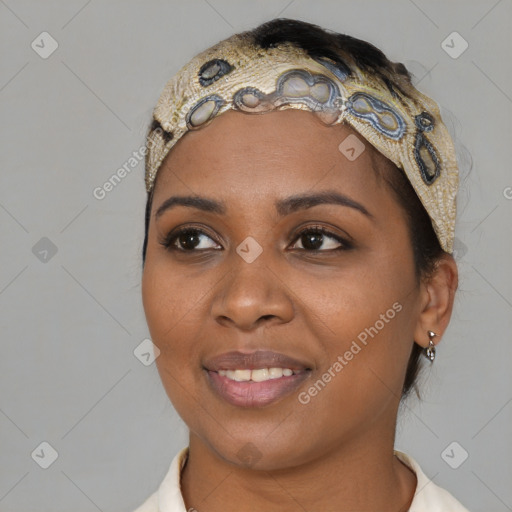 Joyful black young-adult female with short  black hair and brown eyes