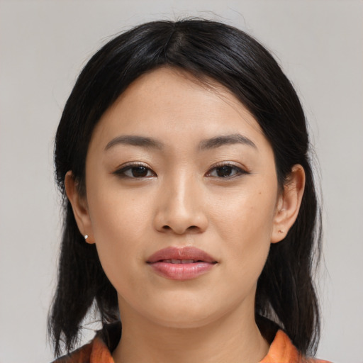Joyful asian young-adult female with medium  black hair and brown eyes