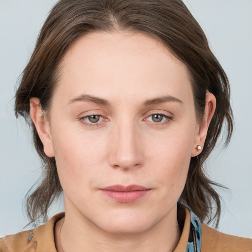 Neutral white young-adult female with medium  brown hair and grey eyes