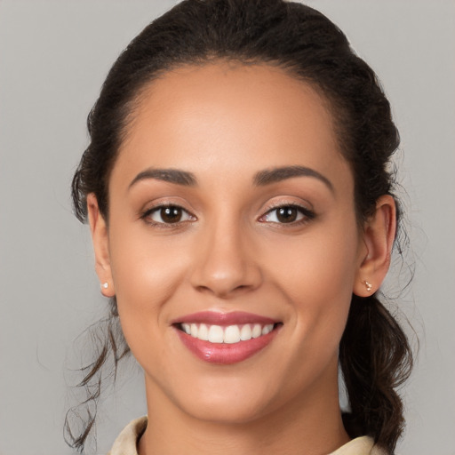 Joyful white young-adult female with medium  brown hair and brown eyes