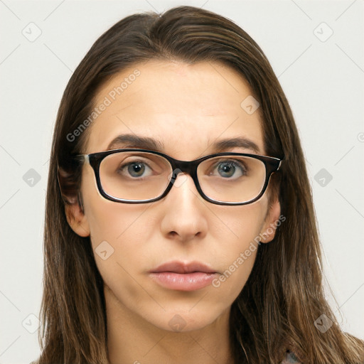 Neutral white young-adult female with long  brown hair and brown eyes