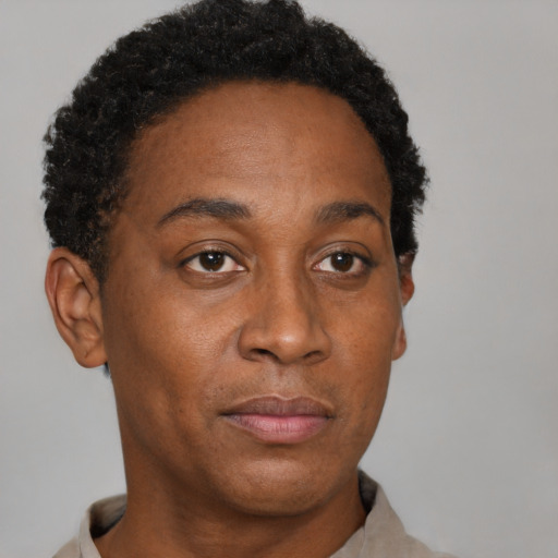 Neutral black adult female with short  brown hair and brown eyes