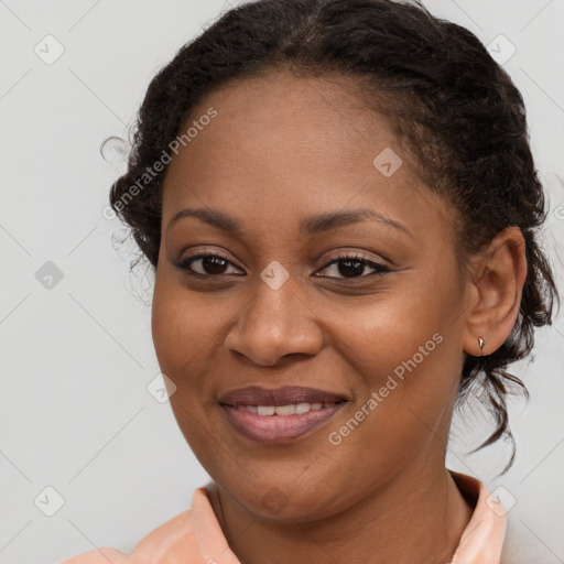 Joyful black young-adult female with medium  brown hair and brown eyes