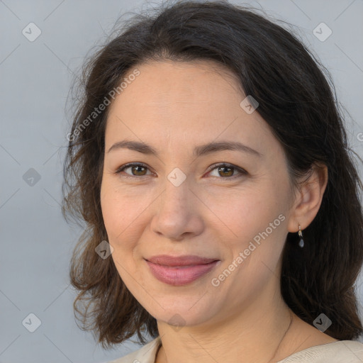 Joyful white adult female with medium  brown hair and brown eyes