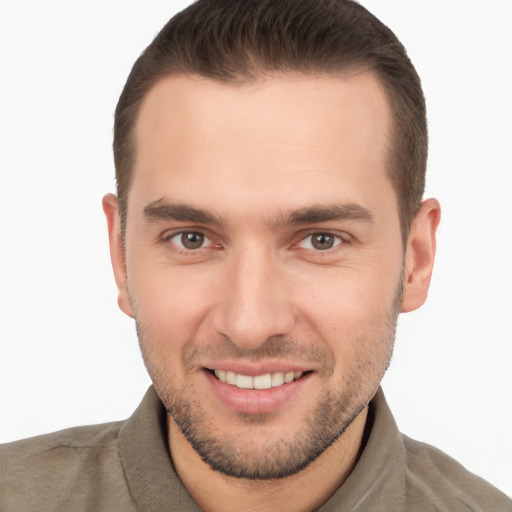 Joyful white young-adult male with short  brown hair and brown eyes