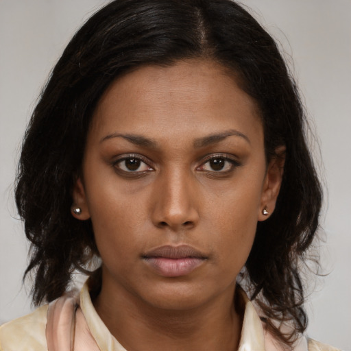 Neutral black young-adult female with medium  brown hair and brown eyes