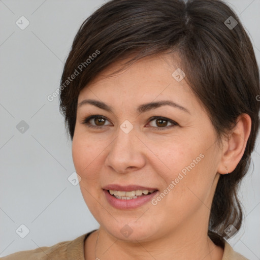 Joyful white young-adult female with medium  brown hair and brown eyes