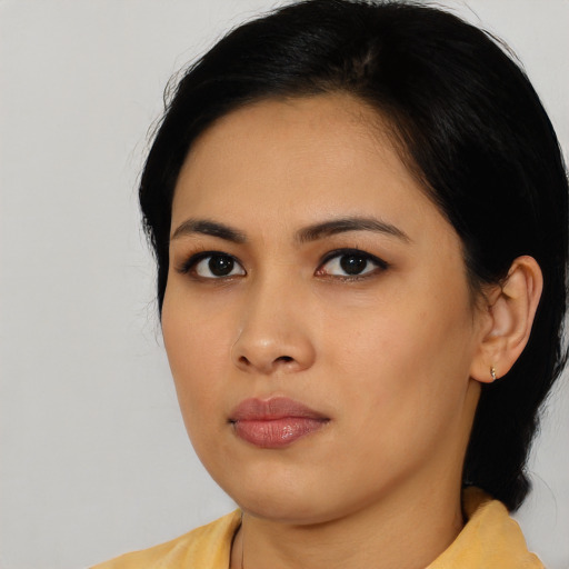 Neutral asian young-adult female with medium  black hair and brown eyes