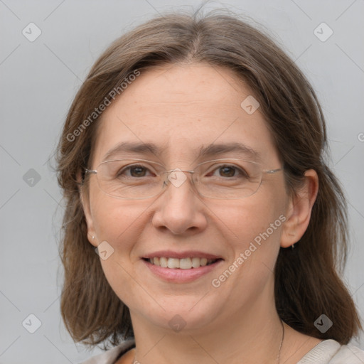 Joyful white adult female with medium  brown hair and grey eyes