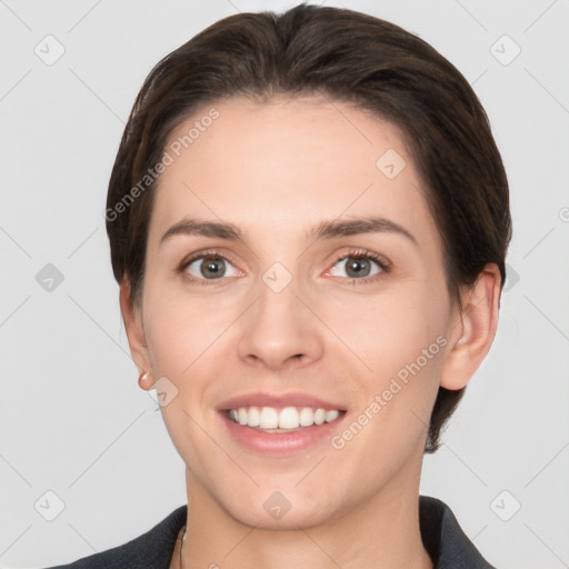 Joyful white young-adult female with short  brown hair and brown eyes