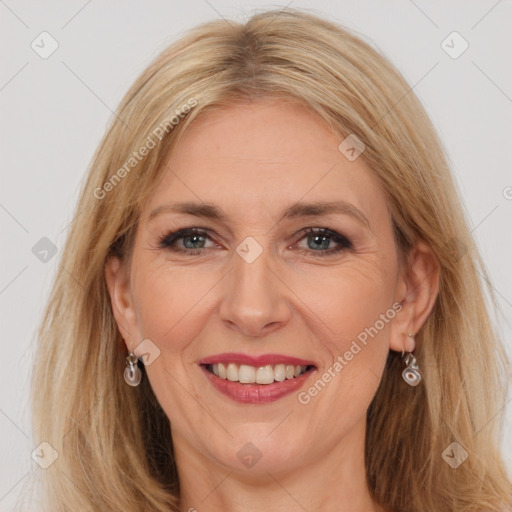 Joyful white adult female with long  brown hair and grey eyes