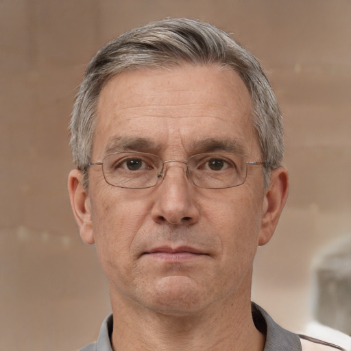 Neutral white middle-aged male with short  gray hair and brown eyes