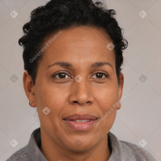 Joyful black adult female with short  brown hair and brown eyes