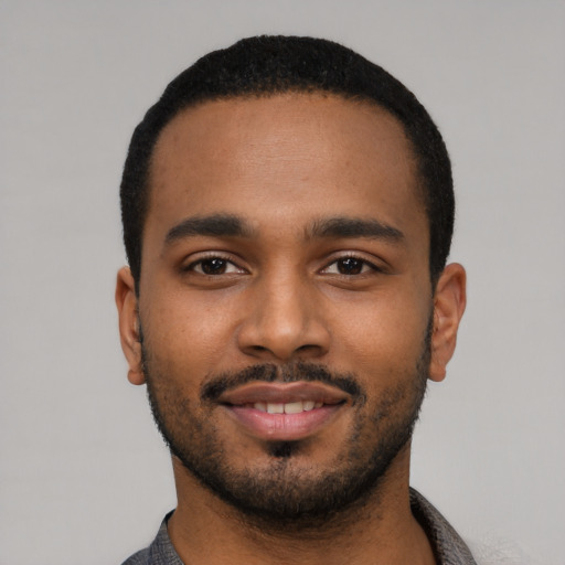 Neutral black young-adult male with short  black hair and brown eyes
