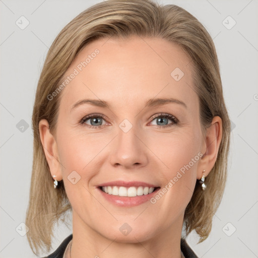 Joyful white young-adult female with medium  brown hair and blue eyes