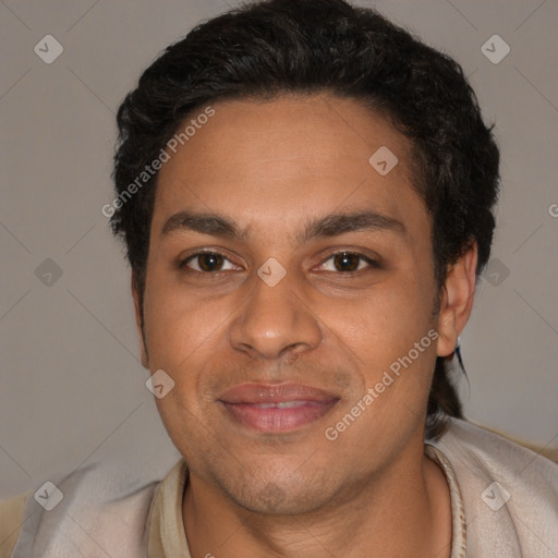Joyful white adult male with short  black hair and brown eyes