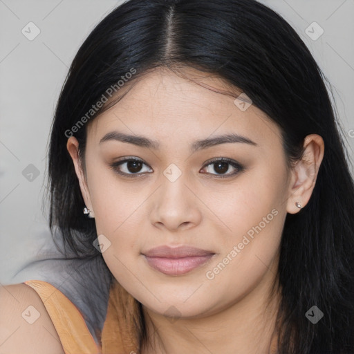 Joyful latino young-adult female with long  brown hair and brown eyes