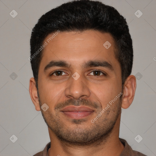 Joyful latino young-adult male with short  black hair and brown eyes