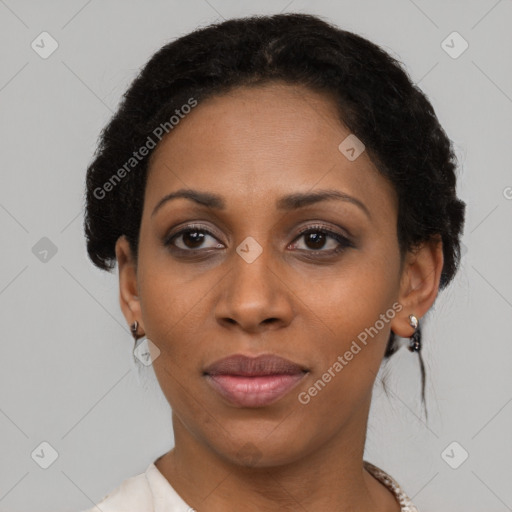 Joyful black adult female with short  black hair and brown eyes