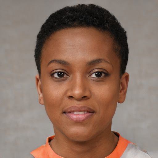 Joyful black young-adult female with short  black hair and brown eyes