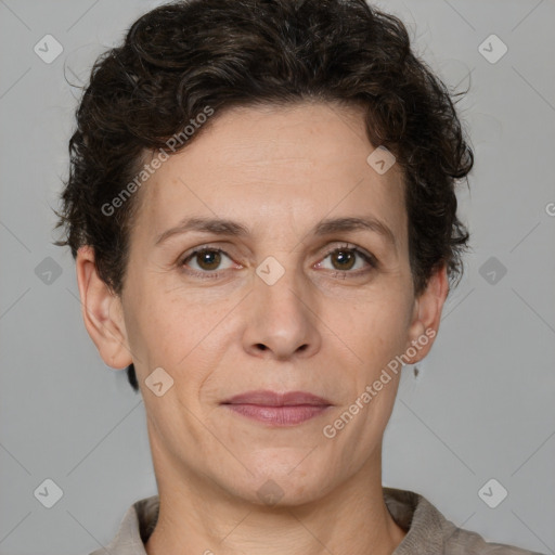 Joyful white adult female with short  brown hair and brown eyes