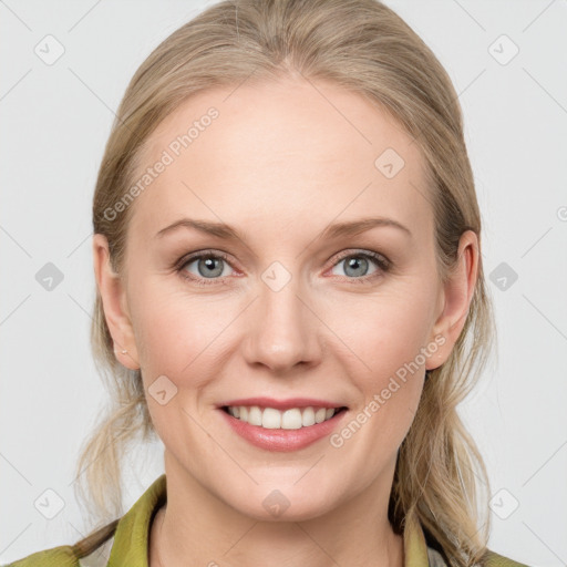 Joyful white young-adult female with medium  brown hair and blue eyes