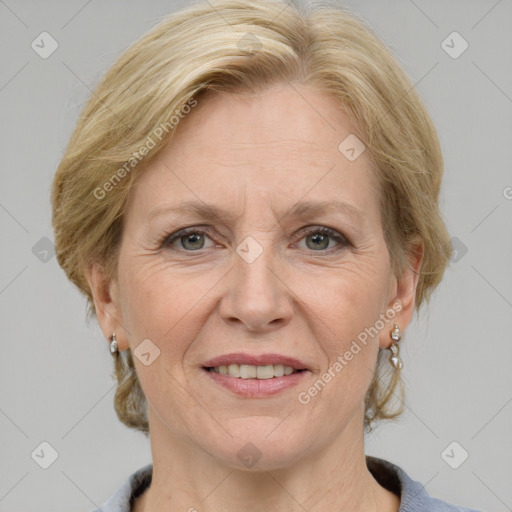 Joyful white adult female with medium  brown hair and grey eyes