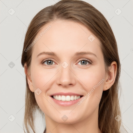 Joyful white young-adult female with long  brown hair and grey eyes