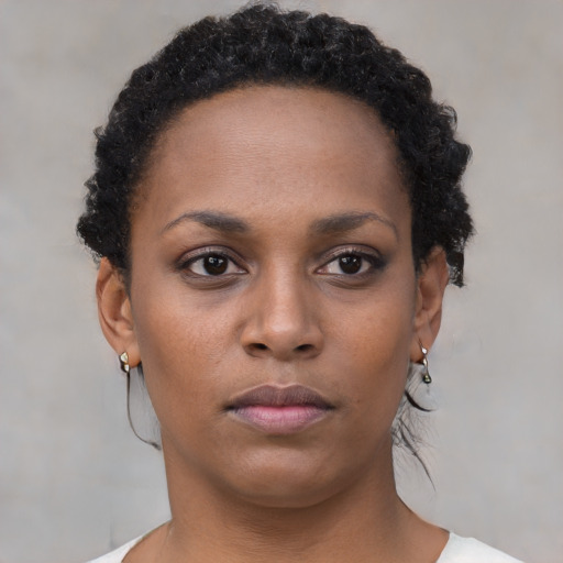 Neutral black young-adult female with short  brown hair and brown eyes