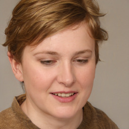 Joyful white young-adult female with medium  brown hair and blue eyes