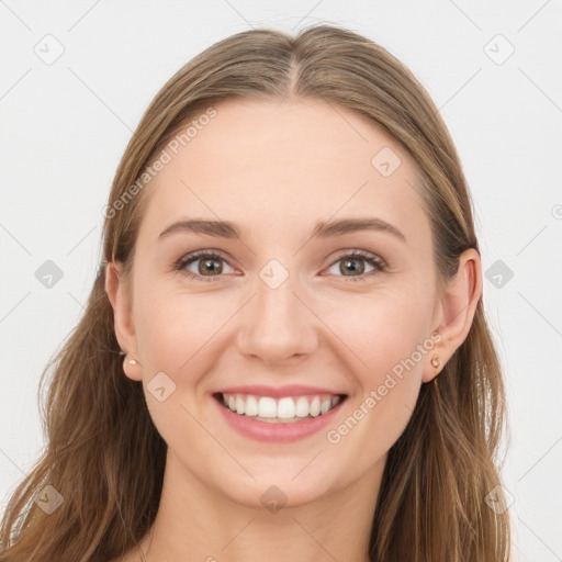 Joyful white young-adult female with long  brown hair and blue eyes