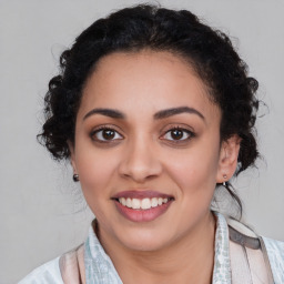 Joyful latino young-adult female with medium  black hair and brown eyes