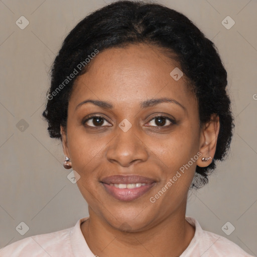 Joyful black adult female with short  black hair and brown eyes