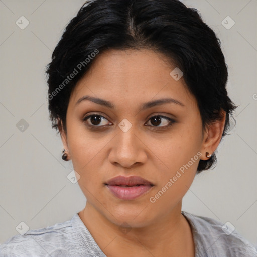 Joyful latino young-adult female with short  black hair and brown eyes