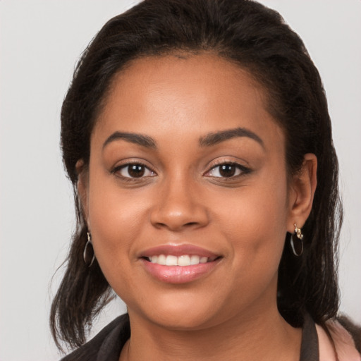 Joyful white young-adult female with long  brown hair and brown eyes