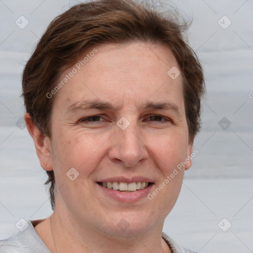 Joyful white adult female with short  brown hair and grey eyes