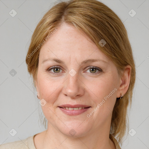 Joyful white adult female with medium  brown hair and blue eyes