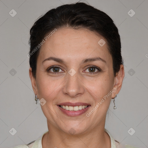 Joyful white adult female with short  brown hair and brown eyes