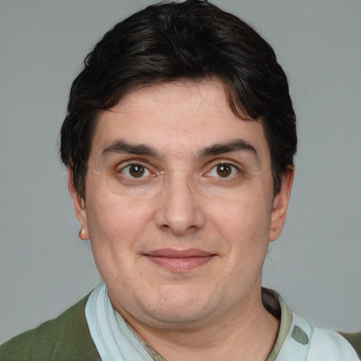 Joyful white adult male with short  brown hair and brown eyes