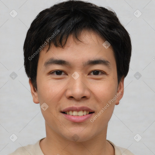 Joyful asian young-adult male with short  brown hair and brown eyes