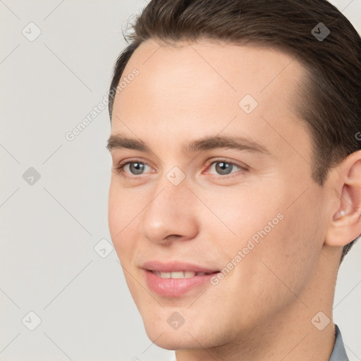 Joyful white young-adult male with short  brown hair and brown eyes